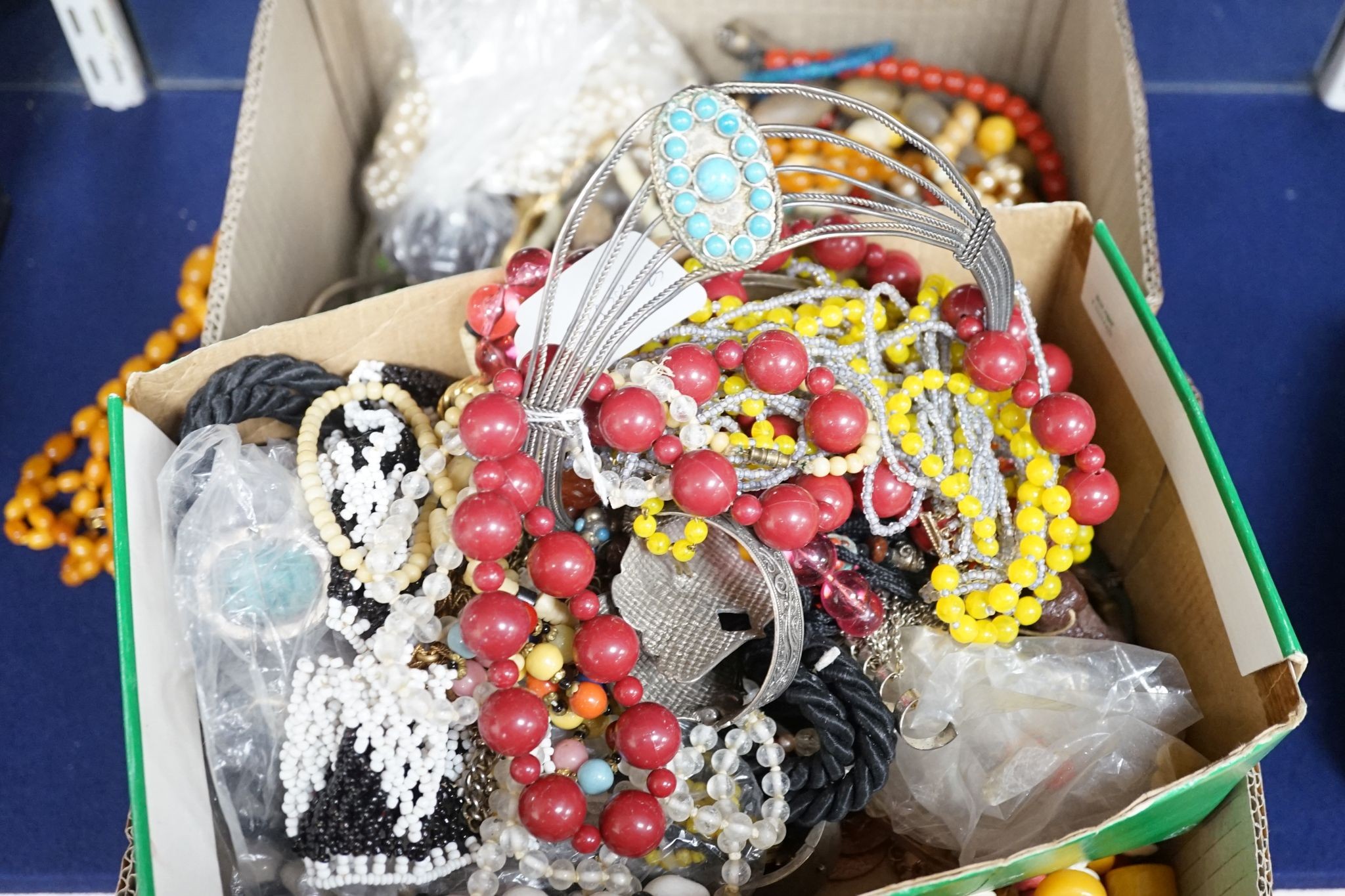 A large quantity of assorted costume jewellery including various necklaces etc.